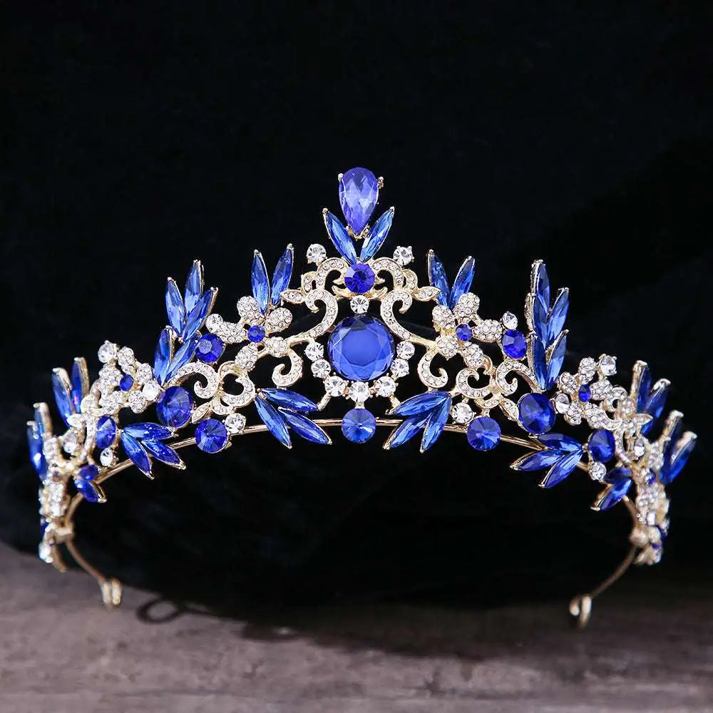 A royal blue gold rhinestone mitzvah crown featuring sparkling crystals and leaf-shaped bridal headdress rhinestone embellishments