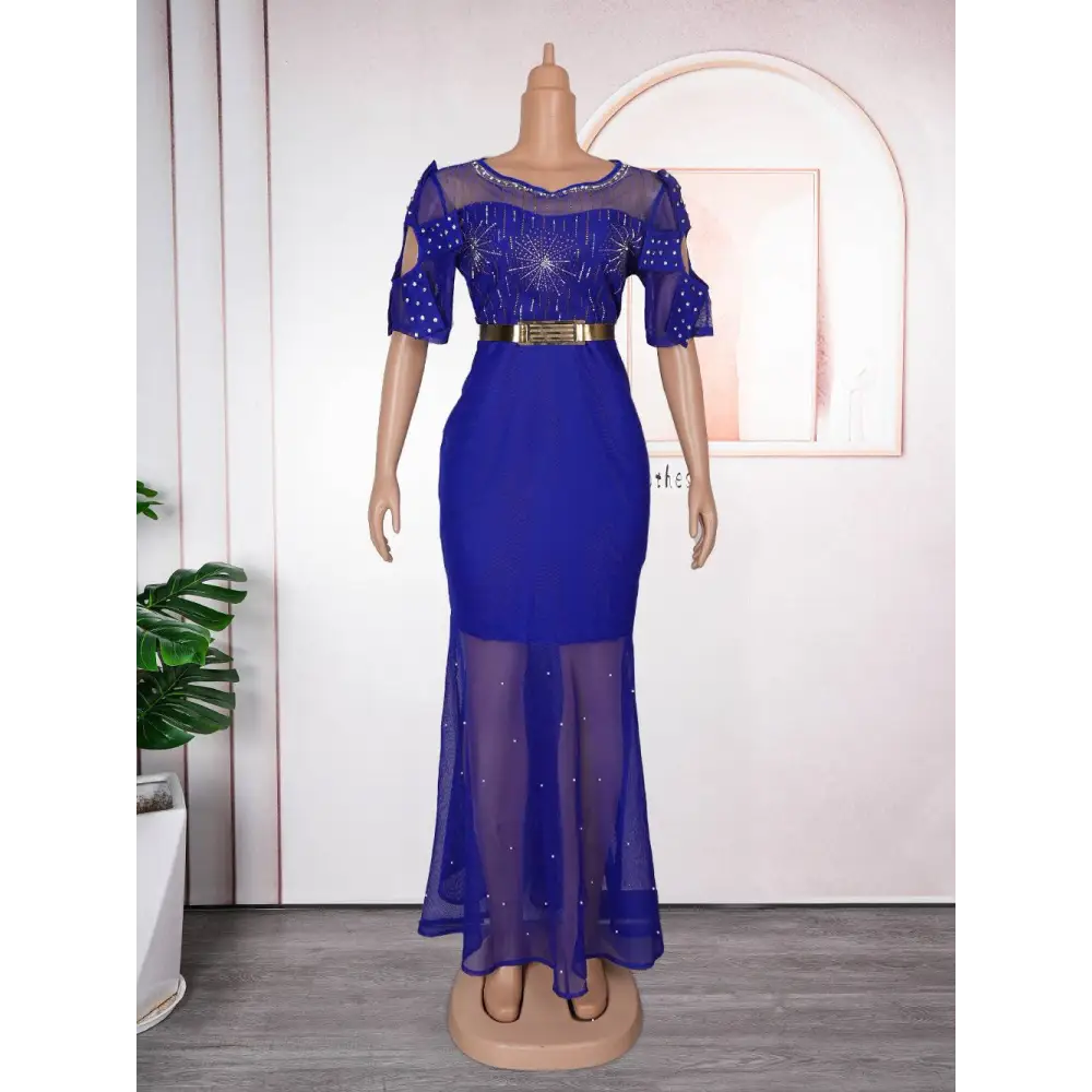 Royal blue heavy embroidered hot diamond beads gown with mermaid style, sheer beaded sleeves, and gold belt