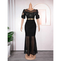 Black mermaid-style dress with sheer beaded bodice and skirt featuring embroidered hot diamond beads gown details