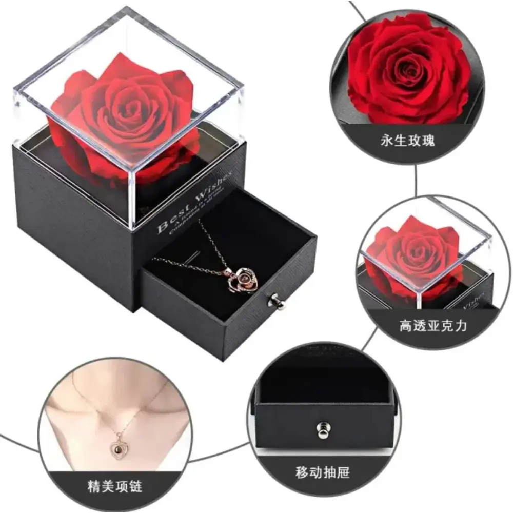 A vibrant red preserved rose in a clear acrylic box with black base and drawer in a royal blue preserved rose jewelry gift box