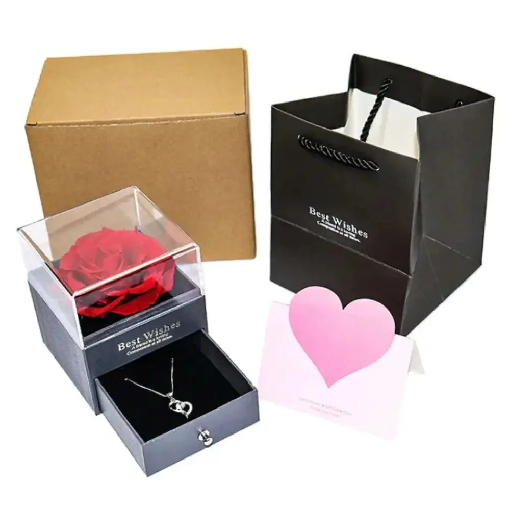 A vibrant red preserved rose encased in a clear acrylic box with a sleek black base for royal blue preserved rose jewelry gift