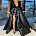 Royal blue sequin evening dress with black sequined bodice satin skirt and high slit showcasing elegant style