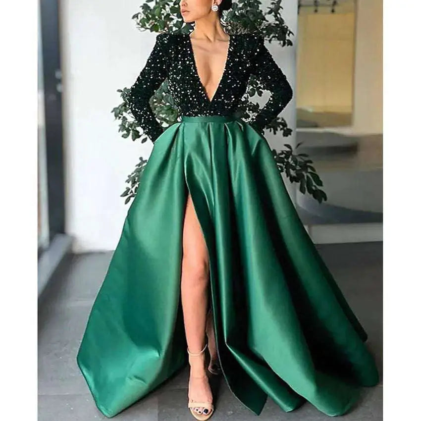 Emerald green satin evening dress with a sparkling black sequined bodice and long sleeves, styled for royal blue sequin looks
