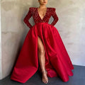 A striking red evening dress with a sequined bodice, satin skirt, long sleeves, and a high slit