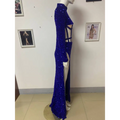 A royal blue siren ji sequin high slit dress featuring a dazzling sequin gown with high neckline and side cut-outs