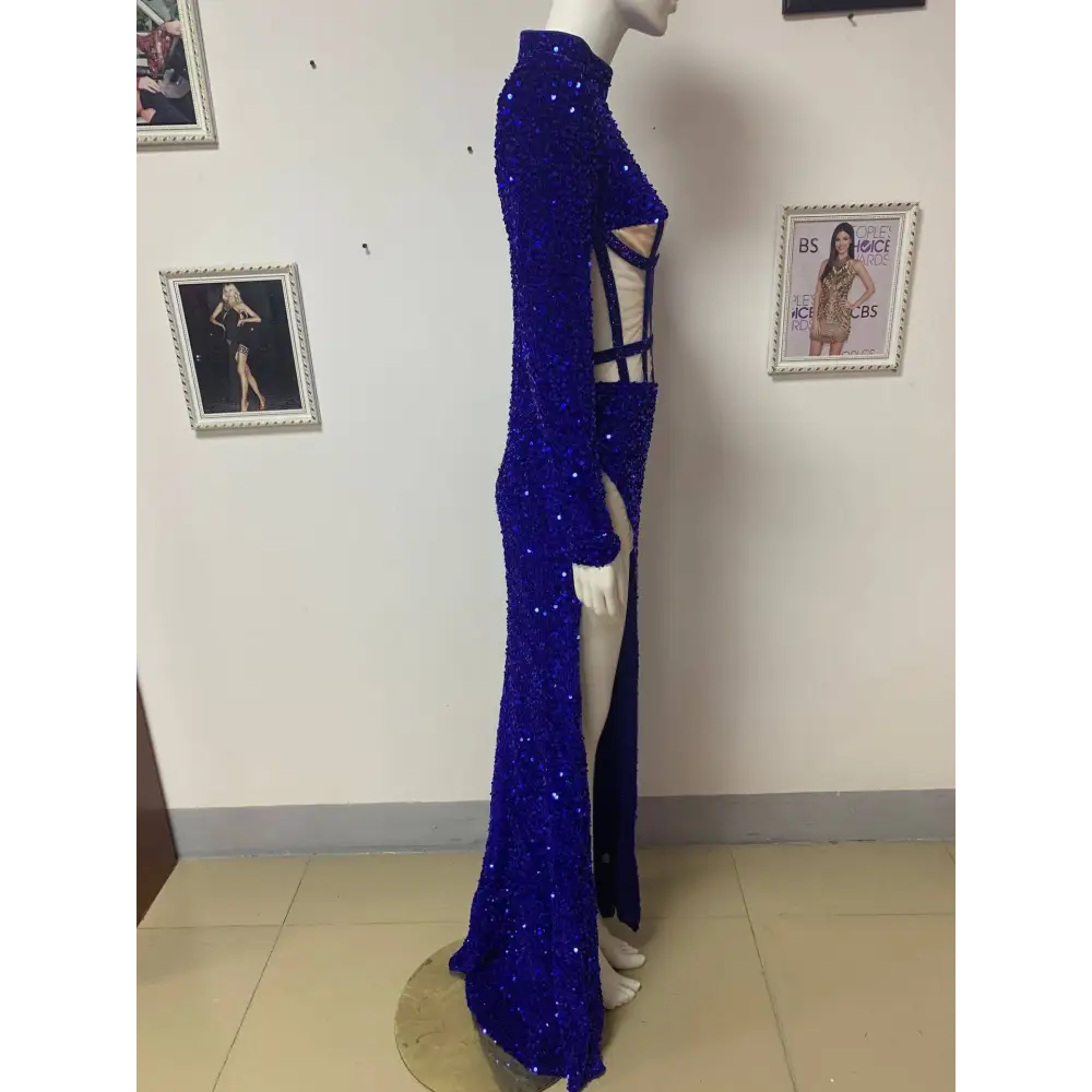 A royal blue siren ji sequin high slit dress featuring a dazzling sequin gown with high neckline and side cut-outs