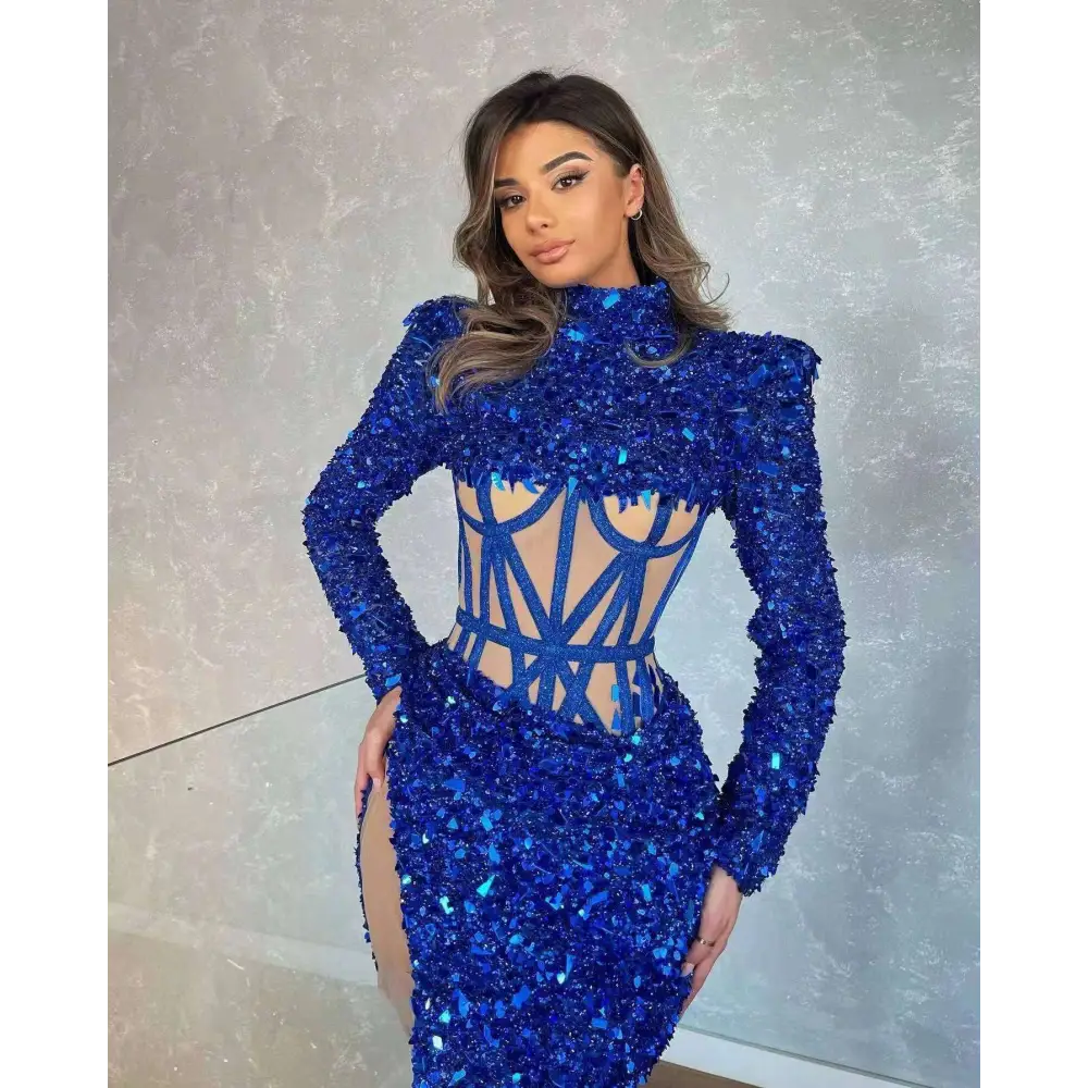 A royal blue siren ji sequin bodycon dress with high neckline long sleeves and geometric cutout design