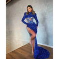 A royal blue siren ji sequin high slit gown with high neckline long sleeves and geometric cutout bodice design