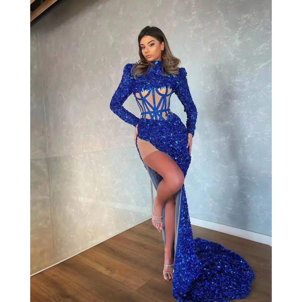 A royal blue siren ji sequin high slit gown with high neckline long sleeves and geometric cutout bodice design
