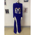 A royal blue siren ji sequin high slit dress with long sleeves, high neckline, and dramatic thigh-high slit