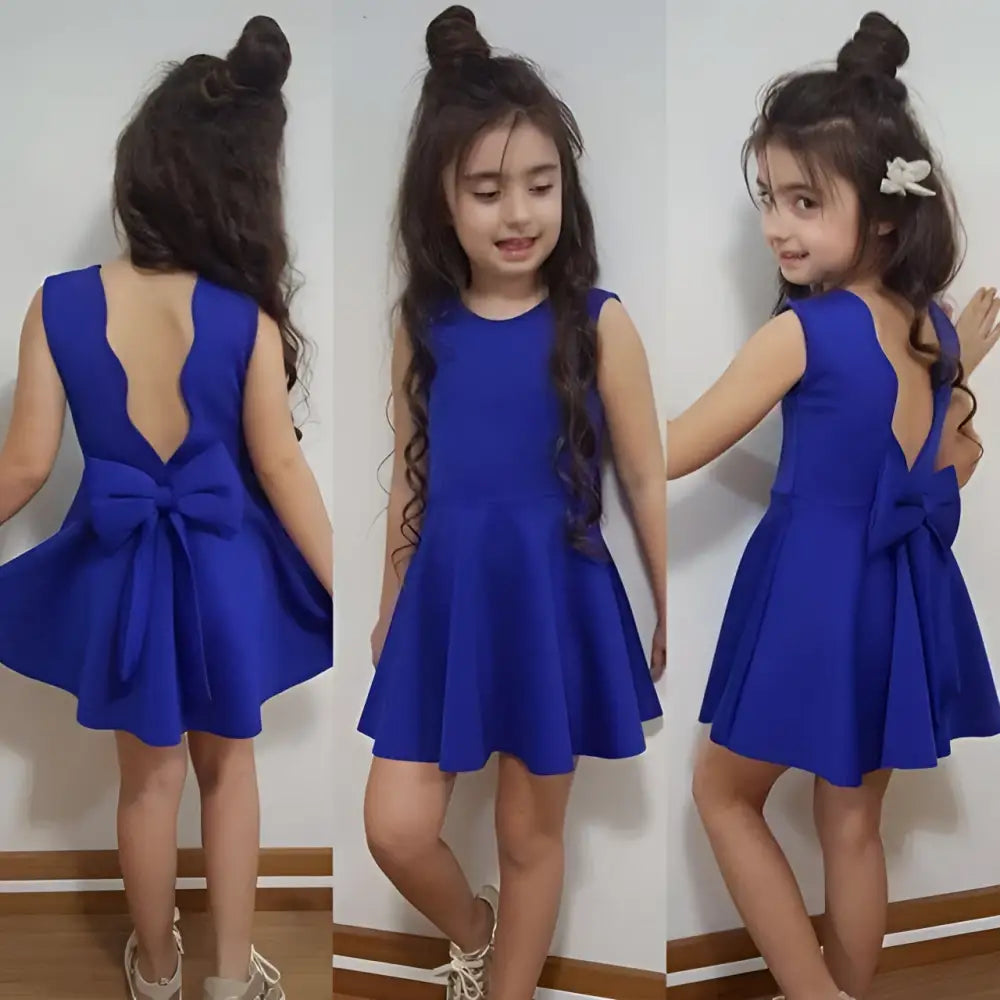 Back view of a royal blue summer girls sleeveless princess dress with a flared skirt and bow detail