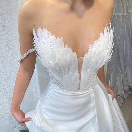 A Dress With Feathers Sweeping The Floor - Royalessencelux