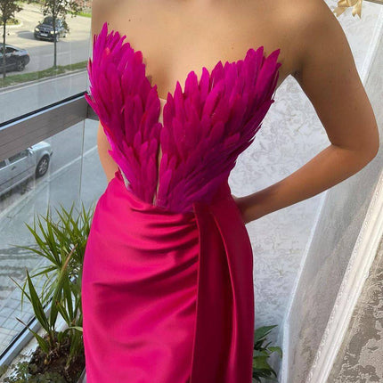 A Dress With Feathers Sweeping The Floor - Royalessencelux