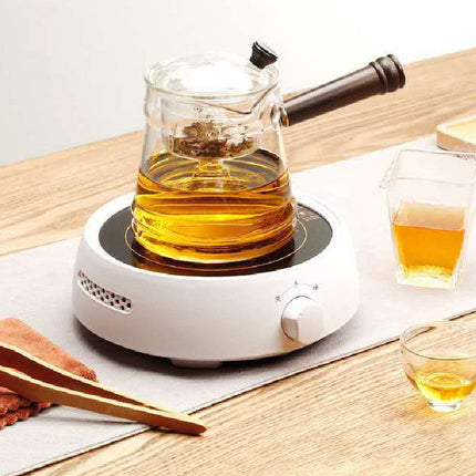 The Electric Earthenware Oven Is Used To Boil The Teapot - Royalessencelux