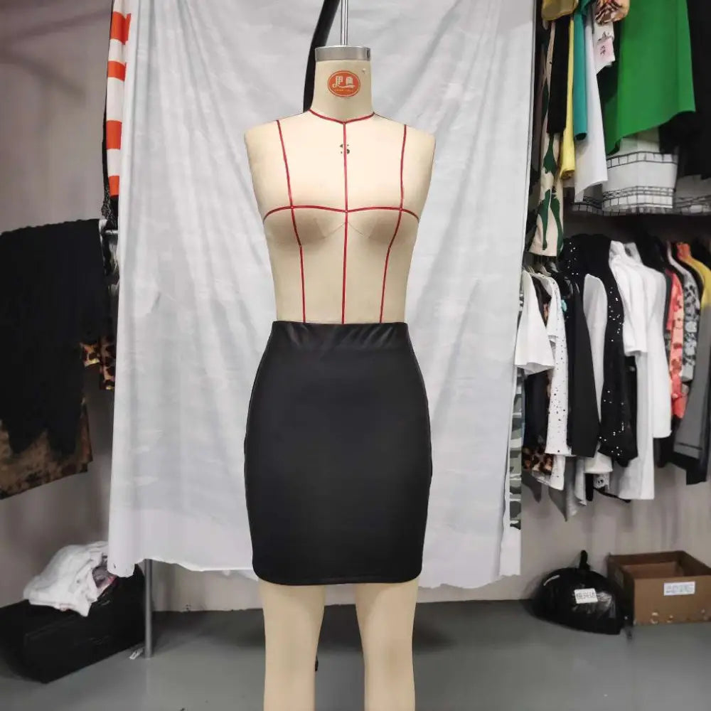 Ruched black high waist tight pu leather mini skirt displayed on a mannequin in front view