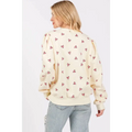 Cream-colored sage fig long sleeve sweatshirt featuring a playful fig heart printed pattern of small pink hearts