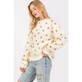 Cream-colored sage fig long sleeve sweatshirt with soft cozy texture and all-over fig heart printed design