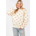 Cream-colored sage fig long sleeve sweatshirt with fig heart printed pattern of small pink hearts scattered across fabric
