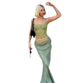 A sage green lace backless tube crop top with sheer floral pattern and stitching ruffle hip detailing