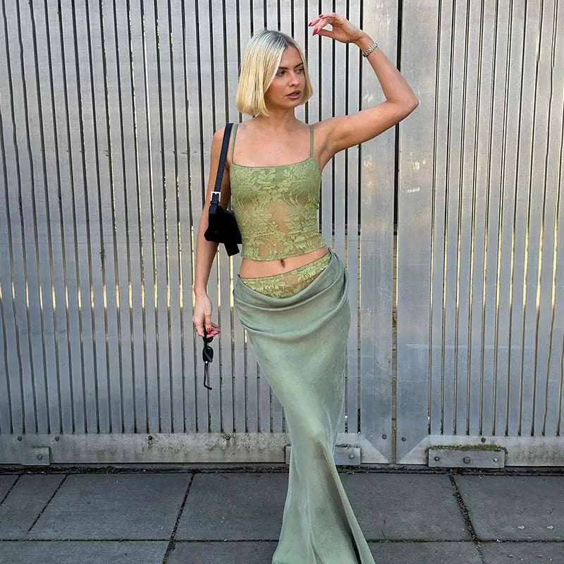 A sage green lace backless tube crop top with sheer floral design stitching ruffle hip detail and thin straps