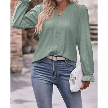 A sage green lace long-sleeved blouse with eyelet pattern and ruffled cuffs is a fashionable versatile shirt
