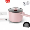 Sage green matte electric cooking pot with matching lid black glass and integrated heating element base for easy use