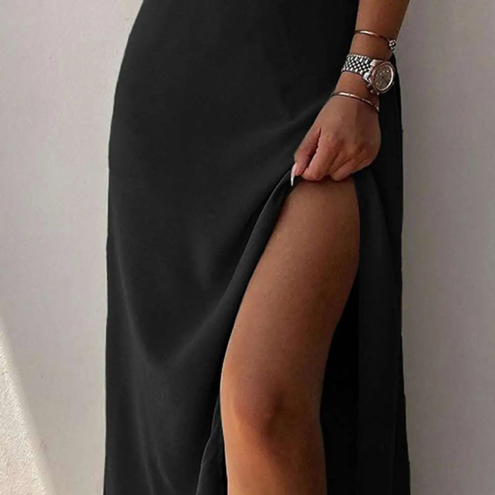 A sleek black satin maxi skirt with a high slit complementing sling dress summer fashion satin slit sling style