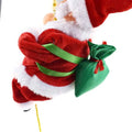Red and white plush santa claus figurine with green fabric sack in climbing rainbow parachute toy design