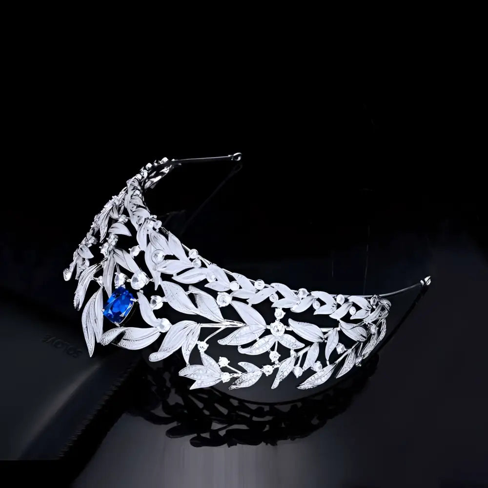 Silver leaf-patterned sparkling silver tiara with copper micro inlay and central blue gemstone sapphire crown copper