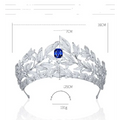 A sparkling silver tiara with copper micro inlay featuring intricate leaf designs and a central cushion-cut blue sapphire sapphire crown copper