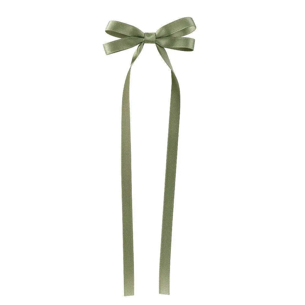 A delicate sage green satin bow braided hair ribbon tie set with long flowing tails for hair tie double styling