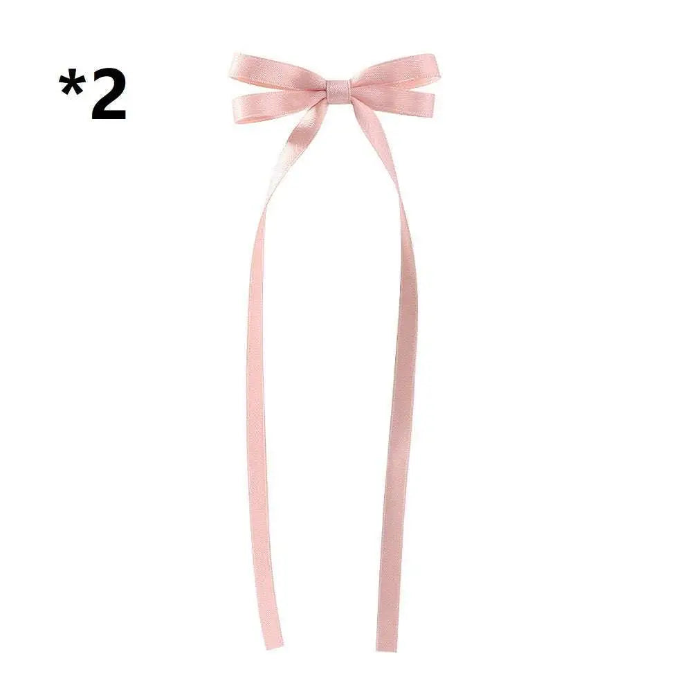 Delicate pink satin bow braided hair ribbon with long flowing tails for hair tie double styling