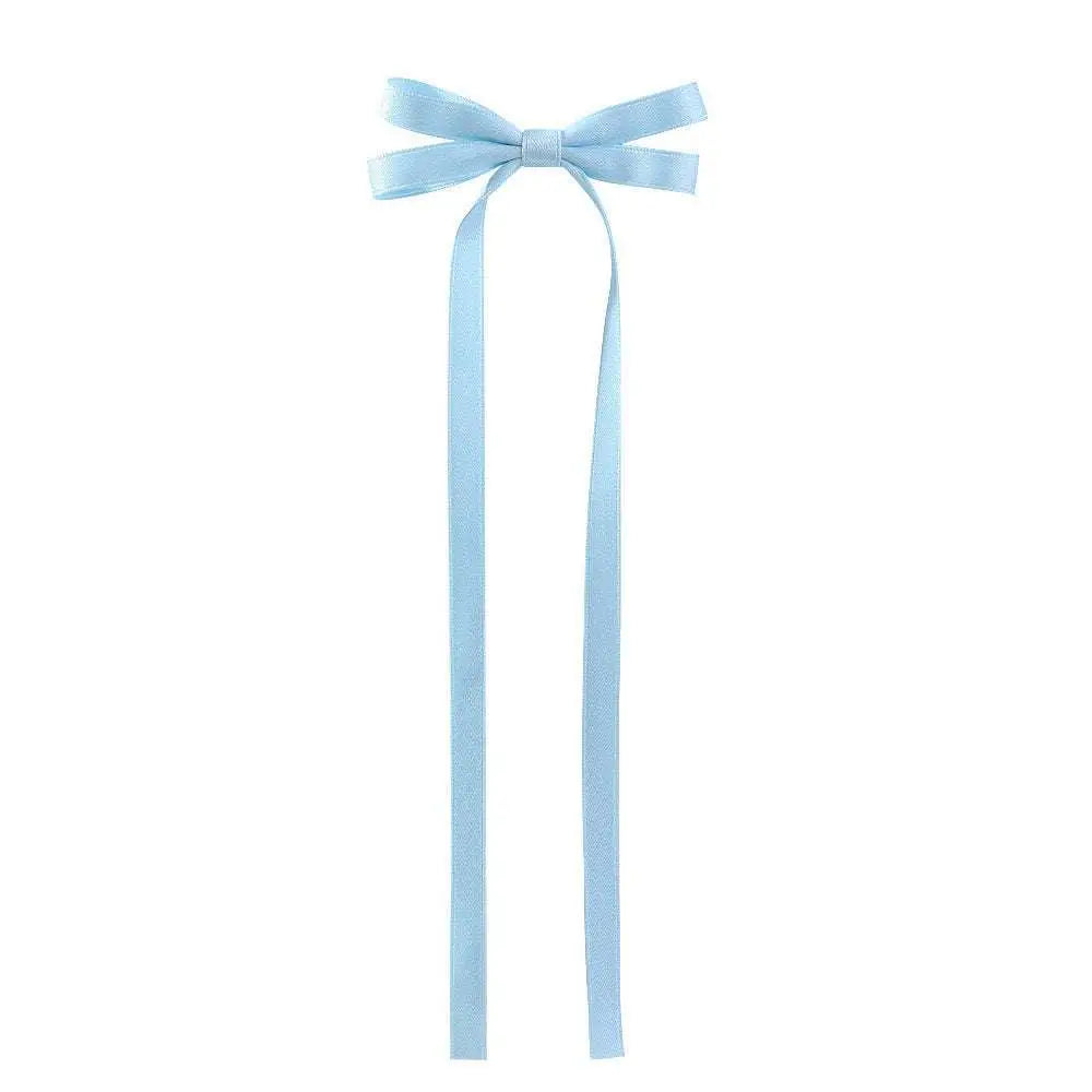 A delicate light blue satin bow braided hair ribbon tie set with long flowing tails for hair styling use