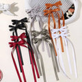 A set of satin bow braided hair ribbon ties in black red gray orange and white made of satin material