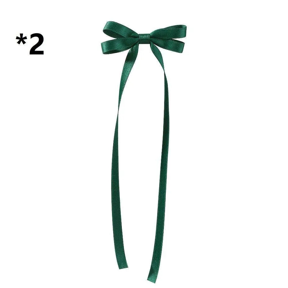 Deep green satin bow braided hair ribbon tie set featuring a neat bow with long flowing tails for hair styling