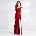 A sleek deep red satin evening dress with an off-the-shoulder neckline and a high slit for formal occasions