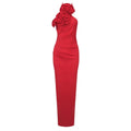 A striking red flower halter gown featuring a satin white ribbon and sculpted floral embellishment on one shoulder