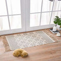 Beige and gray scandinavian style linen cotton rug with geometric pattern and decorative tassels for home decor