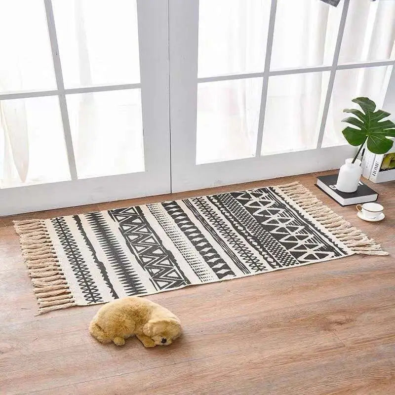 Scandinavian style linen cotton rug with black and cream geometric pattern and fringe tassels for home decor