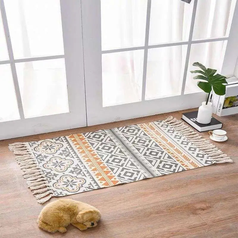 Scandinavian style linen cotton rug with geometric pattern in beige gray and orange tones and tassels on edges