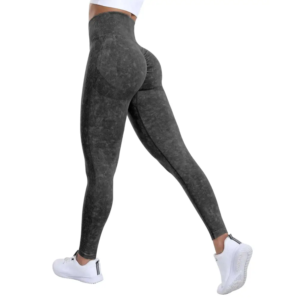 Dark gray scrunch butt workout leggings with high waist, textured pattern, vertical ribbed side panels, and tummy control
