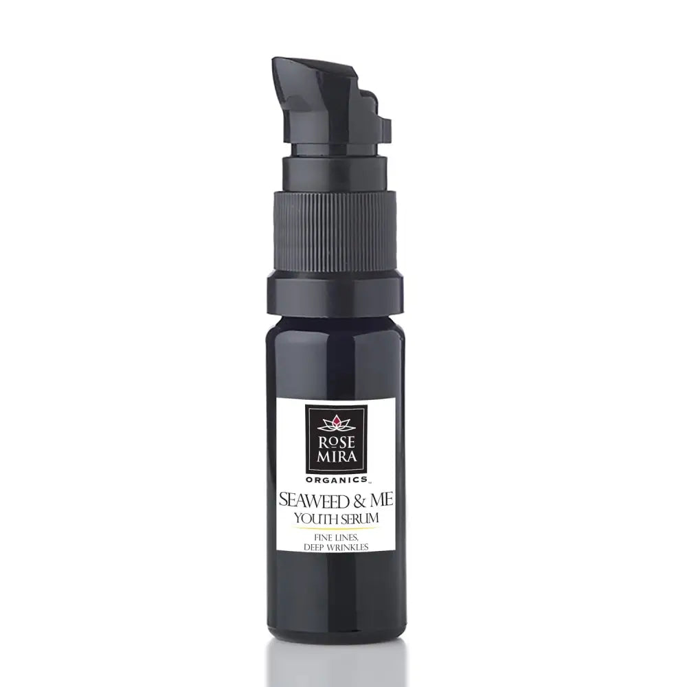 Black glass bottle with black pump dispenser labeled rose mira organics seaweed youth serum for fine lines and wrinkles