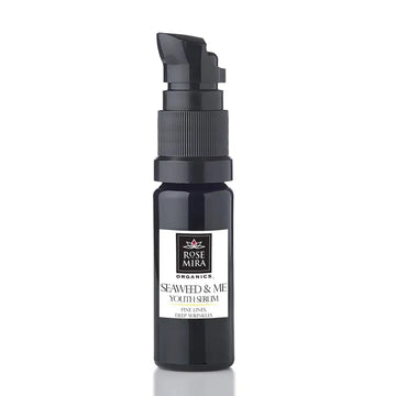Black glass bottle with black pump dispenser labeled rose mira organics seaweed youth serum for fine lines and wrinkles