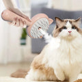 Pink cat-shaped self-cleaning mist cat and dog grooming brush with soft bristles for gentle pet grooming