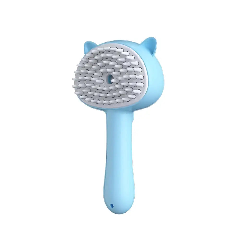 Light blue cat-shaped self-cleaning mist cat and dog grooming brush with soft white bristles and plastic handle