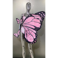 Sequin butterfly latin dance skirt dress with pink and black sequined wings and pink polka dots on silver mannequin