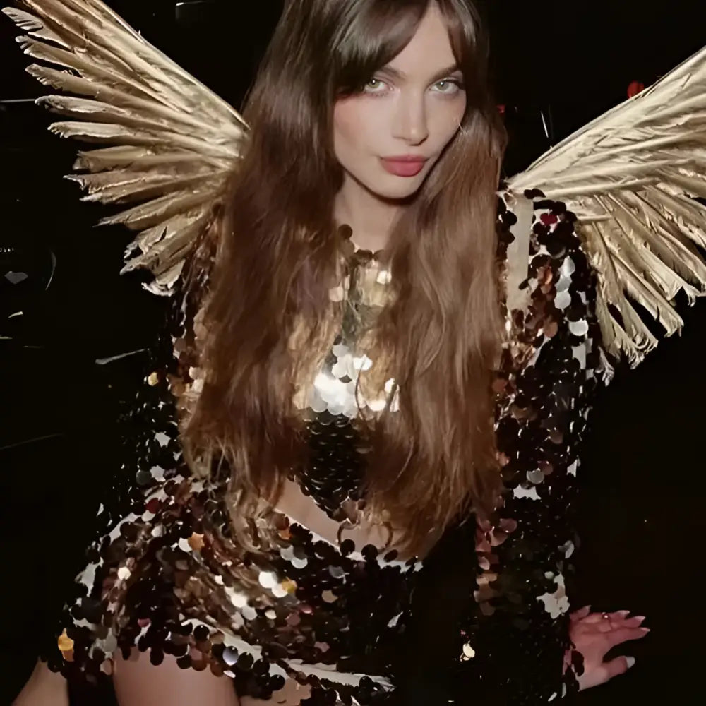 Sequined angel long sleeve round neck evening dress in shimmering black and gold sequins with feathered wings