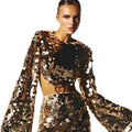 Sequined angel shimmering gold two-piece evening dress with long sleeve round neck and flared sleeves