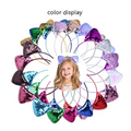 A child wearing a soft pink and purple shimmer sequined cat ear cartoon sweet headband hairpin