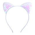 A white sweet headband hairpin with sequined cat ear design featuring shimmering pink and iridescent patterns